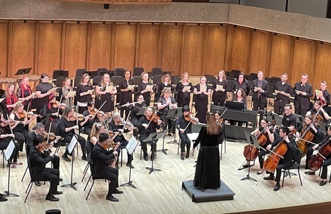 The medical orchestra and choir on stage in performance.
