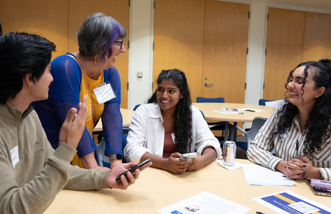 LCoB students smiling and interacting with a mentor.