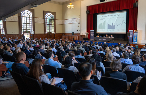 People sit in Morris Dailey Auditorium to watch Chris Thornberg speak at the 2025 Economic Summit.
