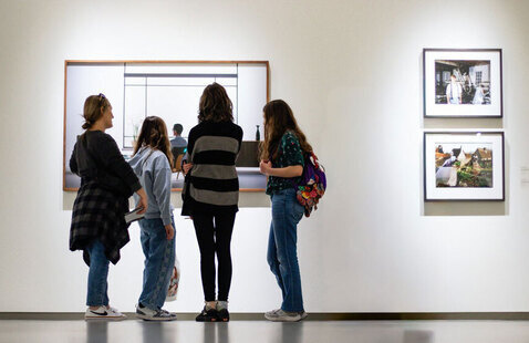 Four people viewing art