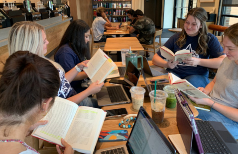 Several students reading books