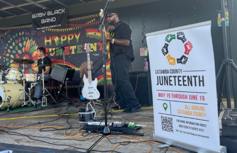 Baby Black Band plays on stage during Juneteenth celebration event