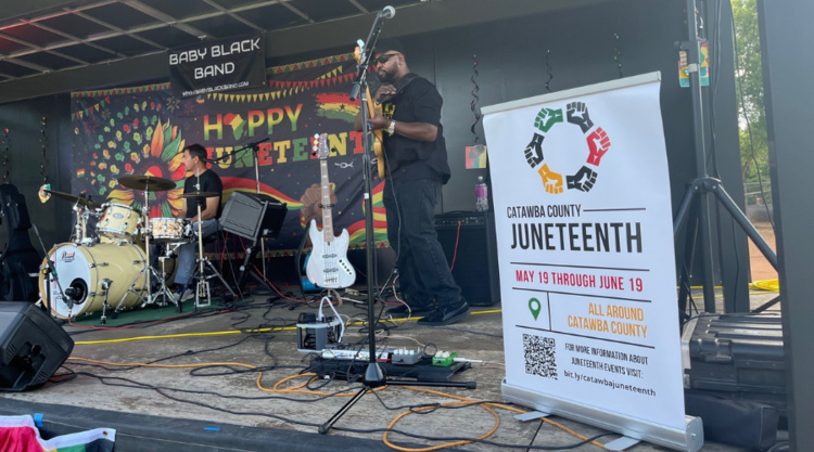 Baby Black Band plays on stage during Juneteenth celebration event