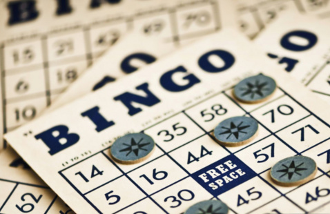 a pile of bingo cards on a table