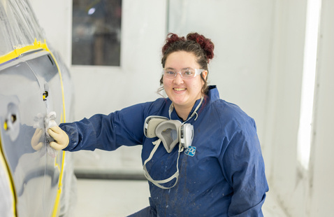 female sanding automobile