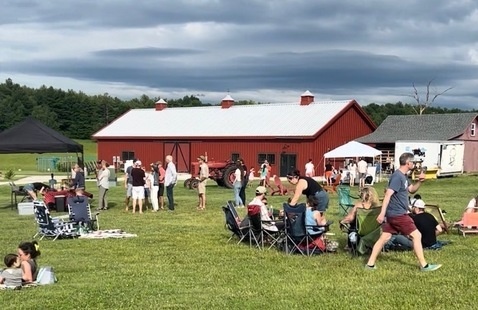 People enjoying live music at Food Truck Friday