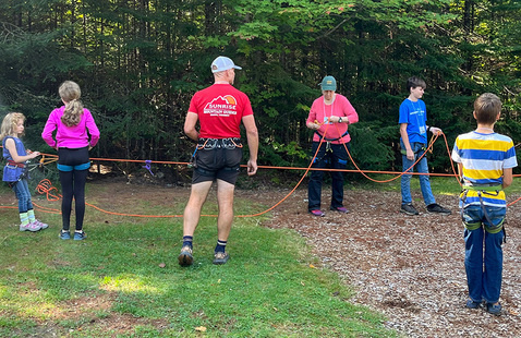 group of kids and adults outdoors