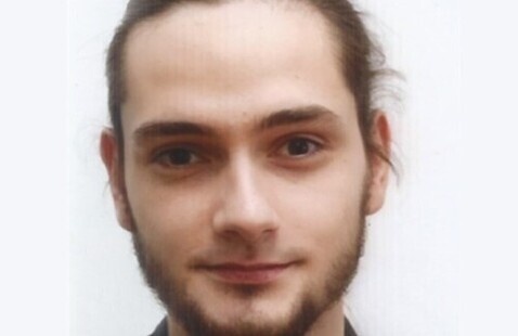 Headshot of a man with a beard.
