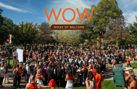 A full campus at a victory party with the weeks of welcome logo 