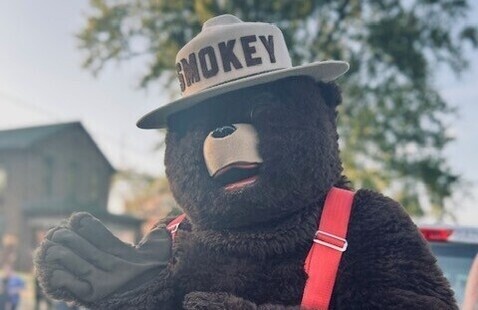 Smokey Bear waving