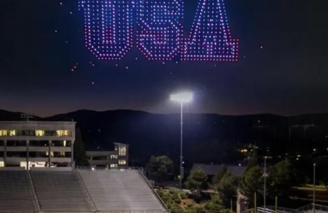 Drones spell out "USA" above the football field. 