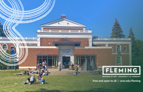 Exterior of the front of the Fleming Museum of Art with students studying on the green.