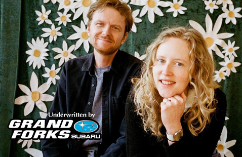 Duo of Bad Bad Hats posed together with text included: underwritten by Grand Forks Subaru