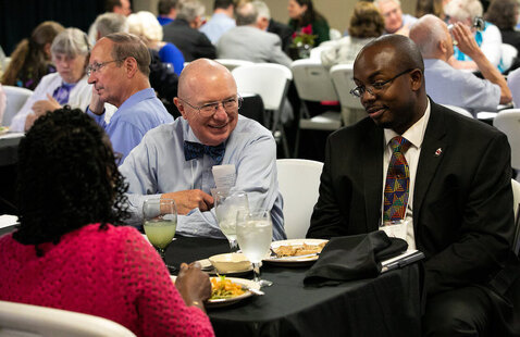 LTSS alumni seated at tables at luncheon