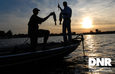 Men on a boat on the lake. 