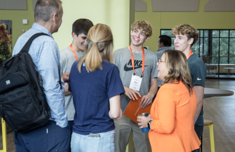 Hope Admissions staff converse with prospective students and their family.