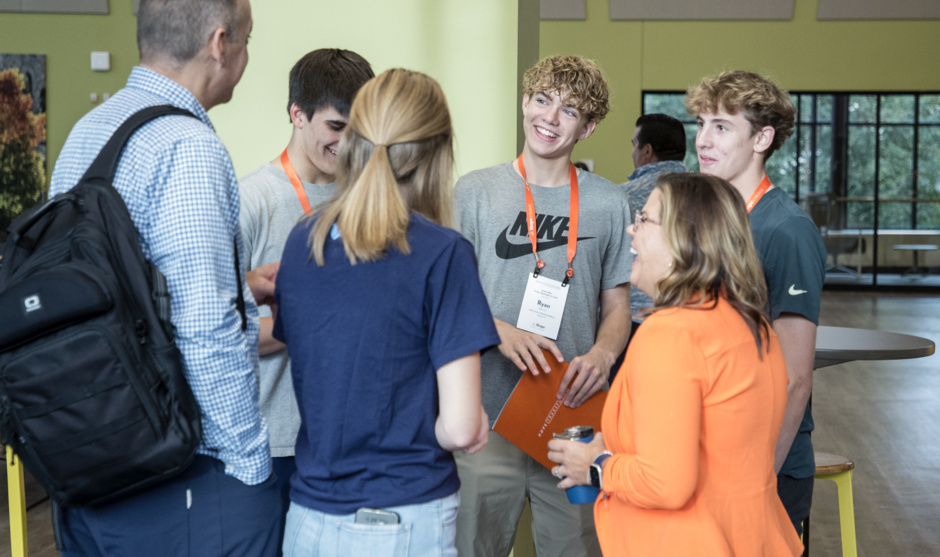 Hope Admissions staff converse with prospective students and their family.