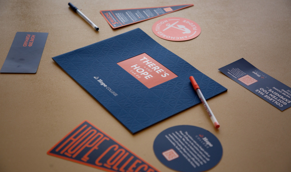 A collection of Hope Collection promotional materials on a table.