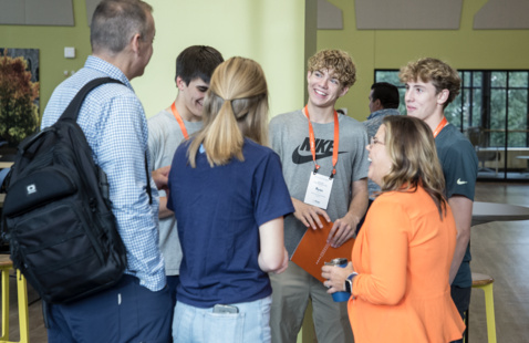 Hope Admissions staff converse with prospective students and their family.