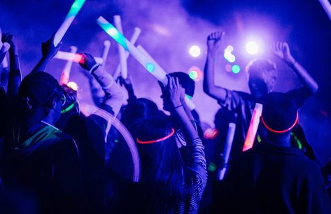 Students dancing with glow sticks
