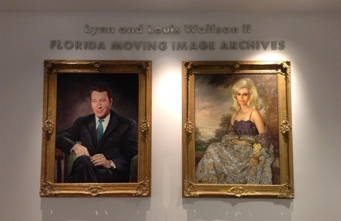 Portraits of Lynn and Louis Wolfson II in the Archives' lobby
