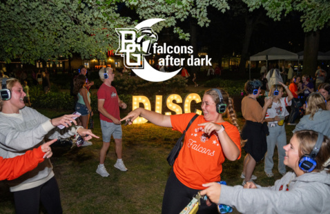 students doing silent disco with the falcons after dark logo