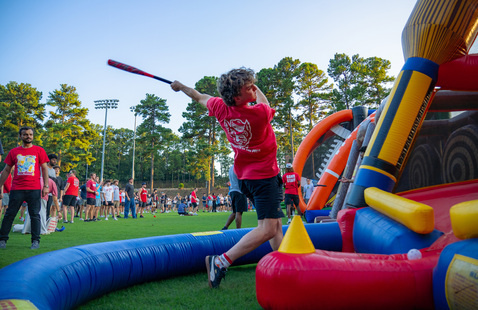A student playing a game at RecFest.