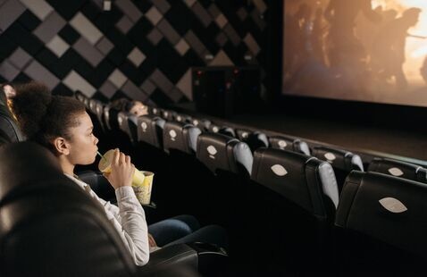 Teen girl in a movie theater