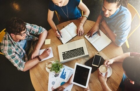 students working around a table