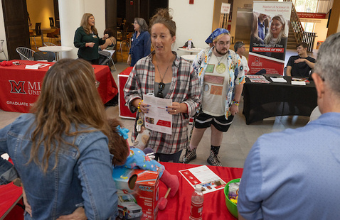 Miami student learning more about graduate school.