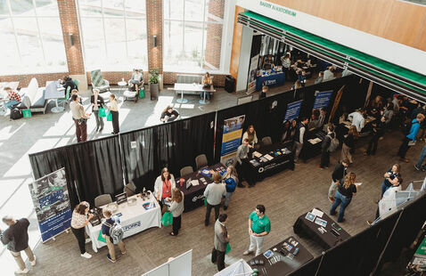 View of career fair booths and attendees from above