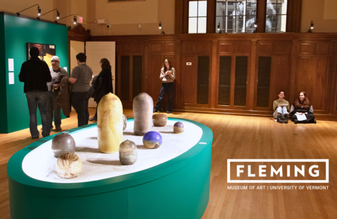 Display of ceramics in center of gallery.