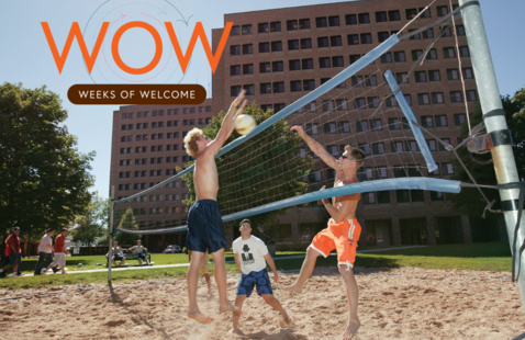 3 students playing volleyball outside with WOW logo 