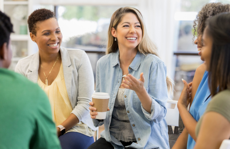 Group of people sitting in a circle having a discussion
