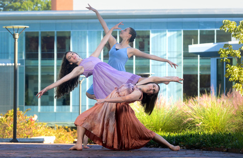 Three dancers posing.