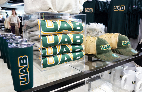 UAB-branded tumblers, T-shirts and hats on display at UAB Bookstore