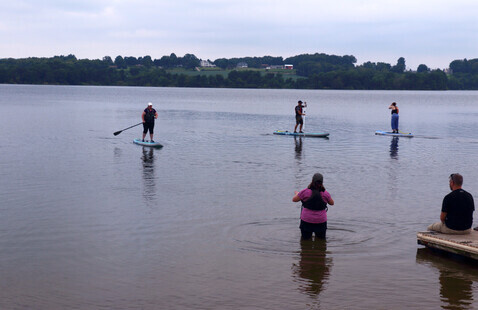 Paddleboarders on lake