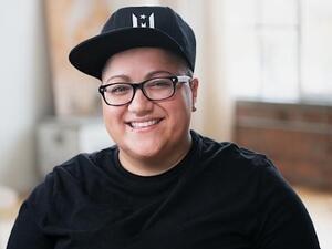 Gabby Rivera smiles facing the camera