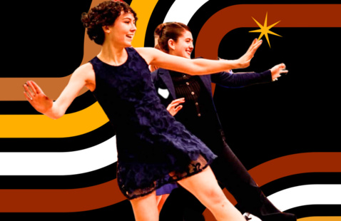 Two people dance the Charleston in front of a colorful background