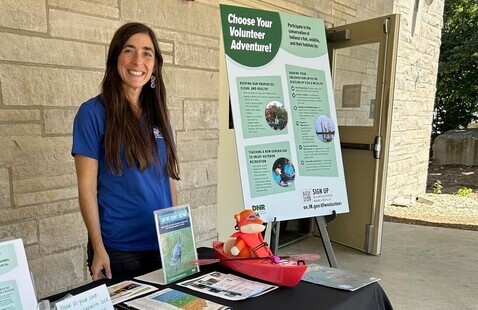 DNR Staff at a booth about choosing a volunteer adventure
