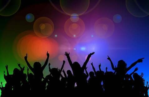 Black outlines of people dancing against a multicolor background