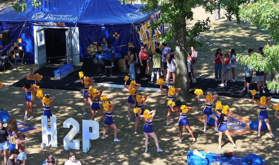 Students gathering at the Hail to Possible Tent