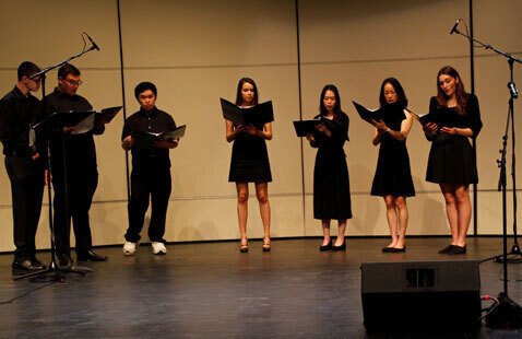 Students performing on stage for the PAC.