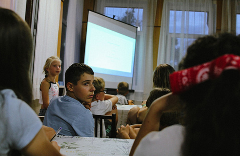 kids seated at a presentation