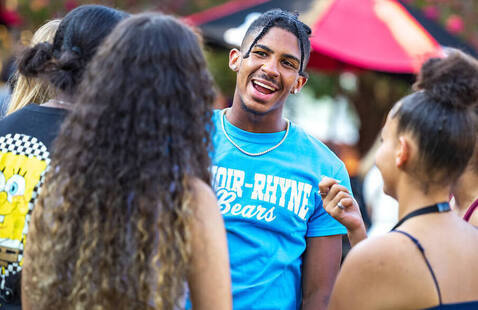 Group of students talking during Welcome Weekend on Shaw Plaza