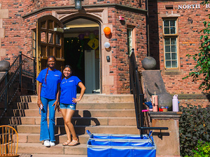 Orientation Leaders pose on steps outside of Rockefeller Hall.