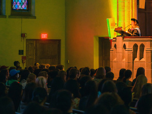 Marcella Runell speaks from the podium to first year students, Honor Code Ceremony.
