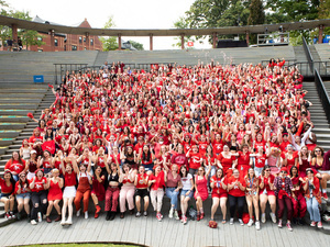 Class photo of students wearing red