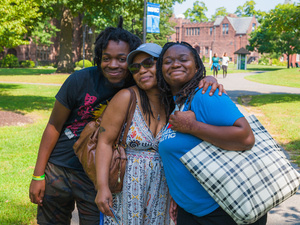 A family smiles together, International Student orientation.