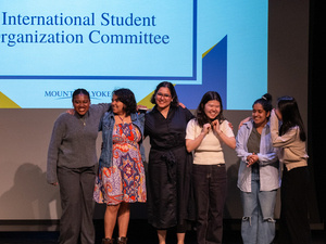 ISOC group pose together on stage.